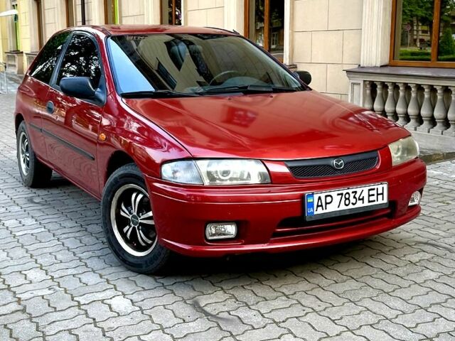 Красный Мазда 323, объемом двигателя 1.3 л и пробегом 340 тыс. км за 1850 $, фото 1 на Automoto.ua