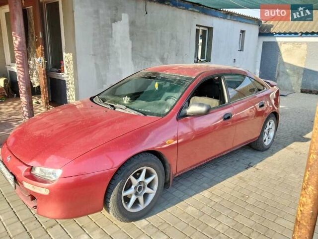 Красный Мазда 323, объемом двигателя 1.5 л и пробегом 290 тыс. км за 2500 $, фото 1 на Automoto.ua