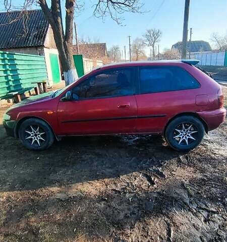 Красный Мазда 323, объемом двигателя 1.5 л и пробегом 272 тыс. км за 2300 $, фото 1 на Automoto.ua