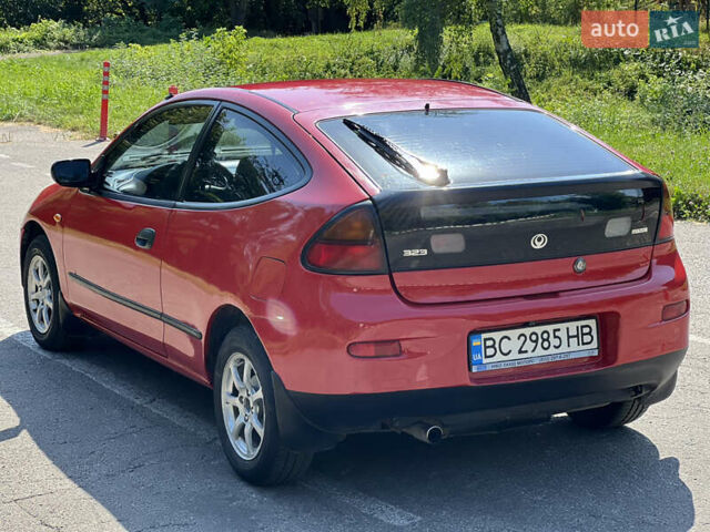 Червоний Мазда 323, об'ємом двигуна 1.5 л та пробігом 300 тис. км за 2299 $, фото 1 на Automoto.ua
