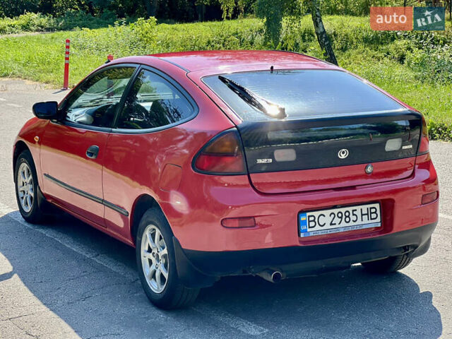 Красный Мазда 323, объемом двигателя 1.5 л и пробегом 300 тыс. км за 1999 $, фото 1 на Automoto.ua