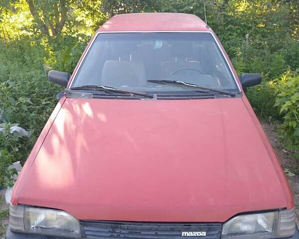 Красный Мазда 323, объемом двигателя 1.7 л и пробегом 250 тыс. км за 407 $, фото 1 на Automoto.ua
