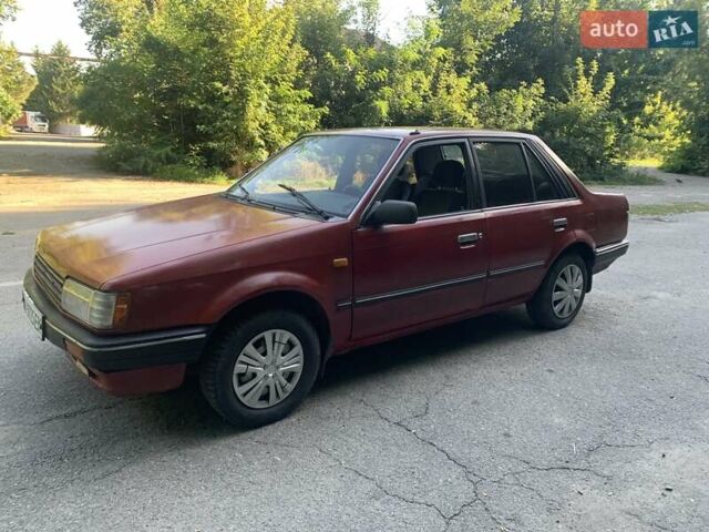 Червоний Мазда 323, об'ємом двигуна 1.3 л та пробігом 450 тис. км за 950 $, фото 1 на Automoto.ua