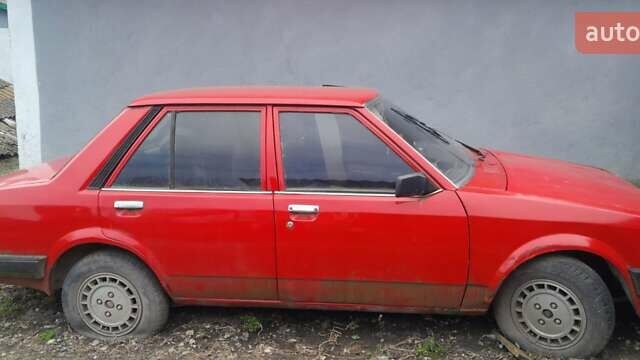 Червоний Мазда 323, об'ємом двигуна 1.5 л та пробігом 260 тис. км за 600 $, фото 1 на Automoto.ua