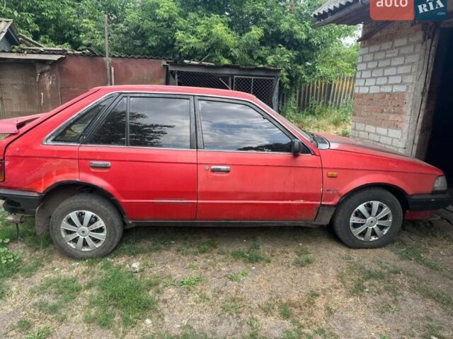 Красный Мазда 323, объемом двигателя 1 л и пробегом 70 тыс. км за 428 $, фото 1 на Automoto.ua