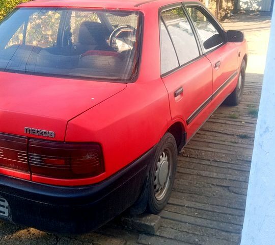 Червоний Мазда 323, об'ємом двигуна 1.7 л та пробігом 0 тис. км за 700 $, фото 1 на Automoto.ua