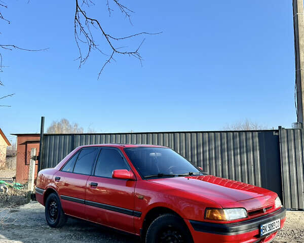 Красный Мазда 323, объемом двигателя 1.6 л и пробегом 215 тыс. км за 2099 $, фото 1 на Automoto.ua