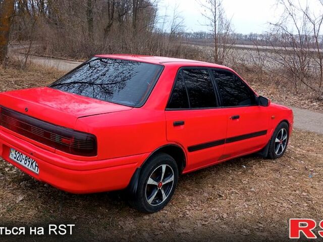 Красный Мазда 323, объемом двигателя 1.3 л и пробегом 222 тыс. км за 1000 $, фото 1 на Automoto.ua