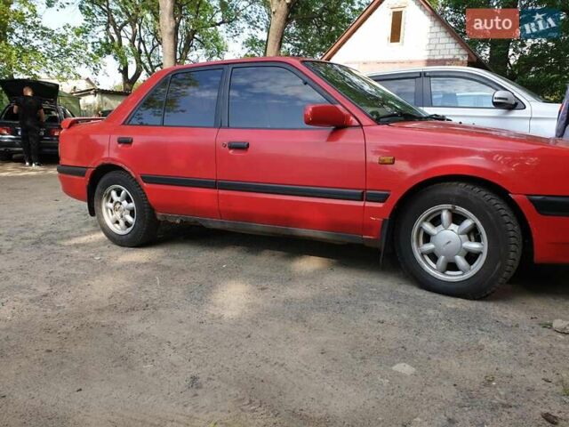 Червоний Мазда 323, об'ємом двигуна 1.5 л та пробігом 339 тис. км за 1900 $, фото 1 на Automoto.ua