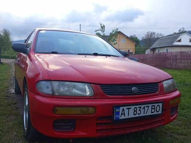 Красный Мазда 323, объемом двигателя 1.3 л и пробегом 344 тыс. км за 1300 $, фото 1 на Automoto.ua