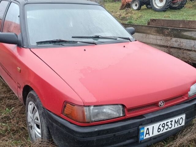 Красный Мазда 323, объемом двигателя 1.3 л и пробегом 300 тыс. км за 475 $, фото 1 на Automoto.ua
