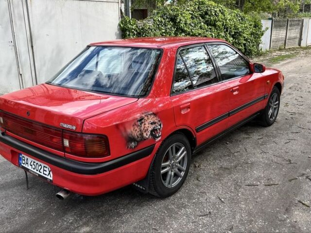 Красный Мазда 323, объемом двигателя 1.6 л и пробегом 313 тыс. км за 2000 $, фото 1 на Automoto.ua
