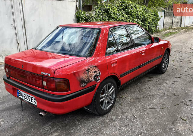 Красный Мазда 323, объемом двигателя 1.6 л и пробегом 313 тыс. км за 2000 $, фото 1 на Automoto.ua