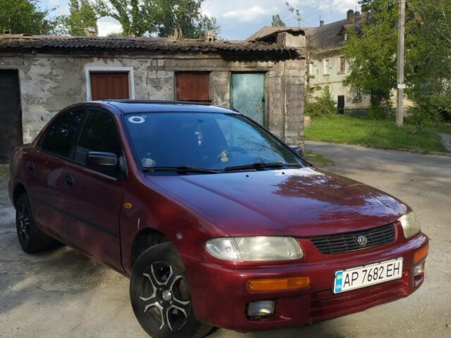 Красный Мазда 323, объемом двигателя 1.6 л и пробегом 416 тыс. км за 2500 $, фото 1 на Automoto.ua