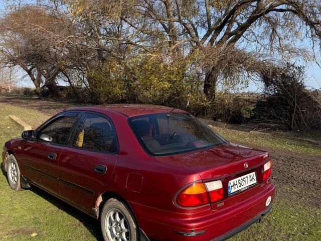 Червоний Мазда 323, об'ємом двигуна 1.8 л та пробігом 1 тис. км за 2450 $, фото 1 на Automoto.ua