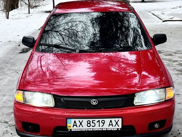 Червоний Мазда 323, об'ємом двигуна 1.5 л та пробігом 300 тис. км за 1500 $, фото 1 на Automoto.ua