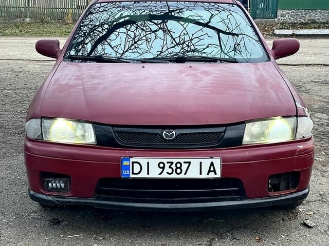 Красный Мазда 323, объемом двигателя 1.5 л и пробегом 0 тыс. км за 1600 $, фото 1 на Automoto.ua