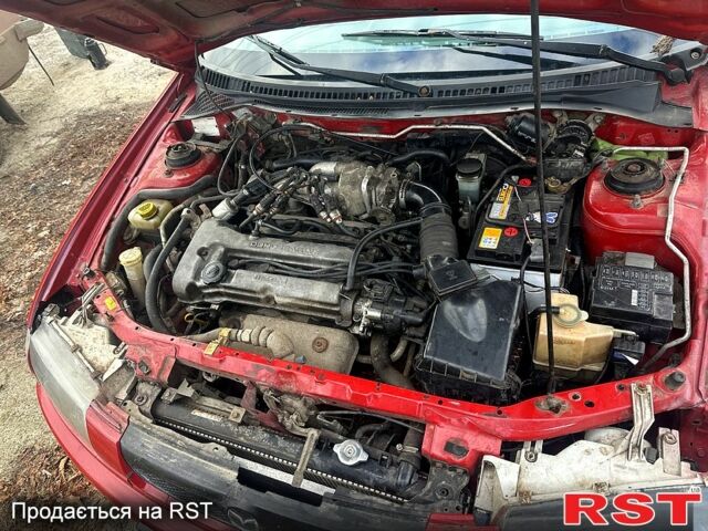 Червоний Мазда 323, об'ємом двигуна 1.5 л та пробігом 300 тис. км за 2200 $, фото 1 на Automoto.ua