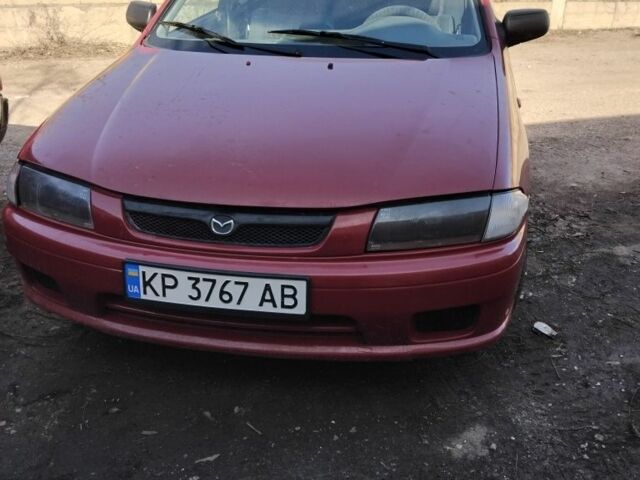 Красный Мазда 323, объемом двигателя 1.5 л и пробегом 520 тыс. км за 1500 $, фото 1 на Automoto.ua