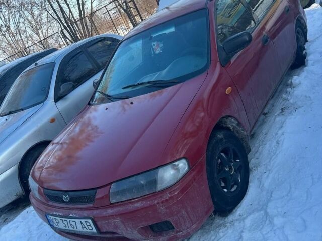 Червоний Мазда 323, об'ємом двигуна 1.5 л та пробігом 250 тис. км за 1800 $, фото 1 на Automoto.ua