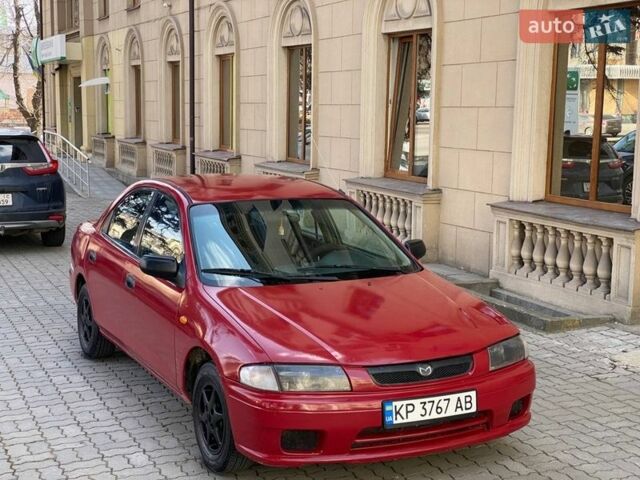 Червоний Мазда 323, об'ємом двигуна 1.49 л та пробігом 250 тис. км за 1650 $, фото 1 на Automoto.ua