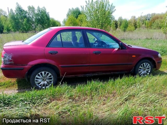 Красный Мазда 323, объемом двигателя 2 л и пробегом 0 тыс. км за 650 $, фото 1 на Automoto.ua