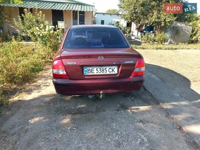 Червоний Мазда 323, об'ємом двигуна 2 л та пробігом 325 тис. км за 3600 $, фото 1 на Automoto.ua