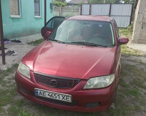 Красный Мазда 323, объемом двигателя 1.6 л и пробегом 329 тыс. км за 2000 $, фото 1 на Automoto.ua