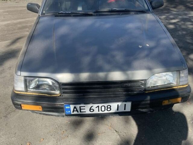 Сірий Мазда 323, об'ємом двигуна 1.3 л та пробігом 150 тис. км за 669 $, фото 1 на Automoto.ua