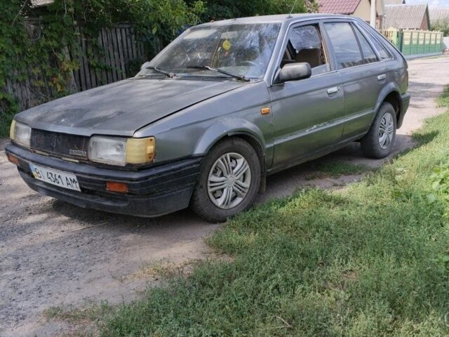 Серый Мазда 323, объемом двигателя 0 л и пробегом 350 тыс. км за 605 $, фото 1 на Automoto.ua