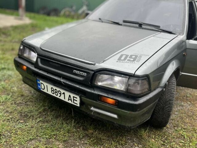Серый Мазда 323, объемом двигателя 1.7 л и пробегом 80 тыс. км за 402 $, фото 1 на Automoto.ua