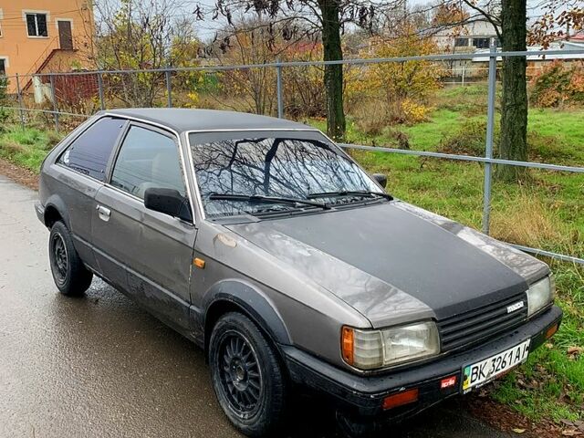 Серый Мазда 323, объемом двигателя 1.6 л и пробегом 330 тыс. км за 600 $, фото 1 на Automoto.ua