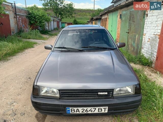 Серый Мазда 323, объемом двигателя 1.3 л и пробегом 203 тыс. км за 700 $, фото 1 на Automoto.ua