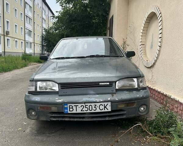 Серый Мазда 323, объемом двигателя 1.32 л и пробегом 342 тыс. км за 1100 $, фото 1 на Automoto.ua
