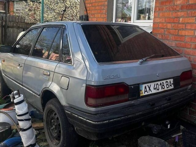 Серый Мазда 323, объемом двигателя 1.5 л и пробегом 100 тыс. км за 448 $, фото 1 на Automoto.ua