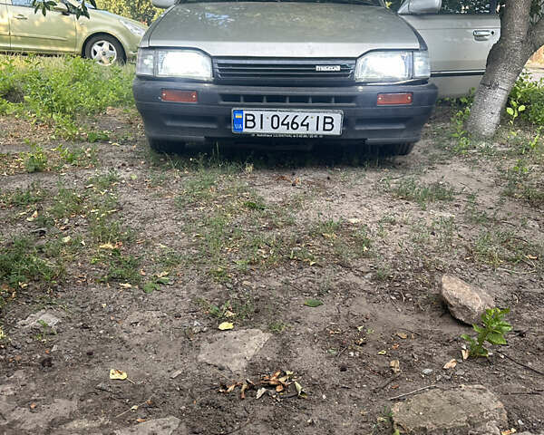 Серый Мазда 323, объемом двигателя 1.32 л и пробегом 153 тыс. км за 1075 $, фото 1 на Automoto.ua