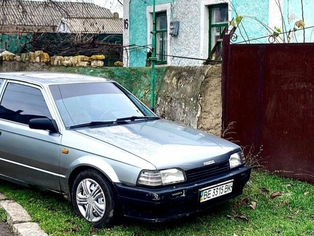 Серый Мазда 323, объемом двигателя 1.3 л и пробегом 400 тыс. км за 1300 $, фото 1 на Automoto.ua