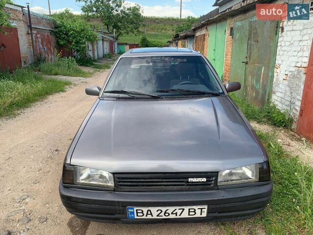 Серый Мазда 323, объемом двигателя 1.3 л и пробегом 203 тыс. км за 700 $, фото 1 на Automoto.ua