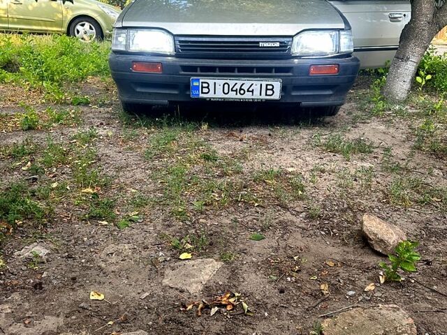 Серый Мазда 323, объемом двигателя 1.3 л и пробегом 167 тыс. км за 530 $, фото 1 на Automoto.ua