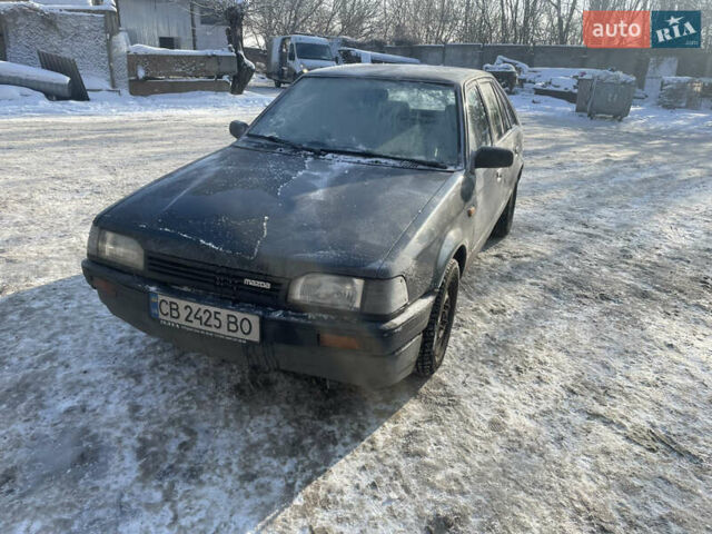 Серый Мазда 323, объемом двигателя 1.32 л и пробегом 442 тыс. км за 900 $, фото 1 на Automoto.ua