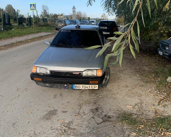 Серый Мазда 323, объемом двигателя 1.32 л и пробегом 460 тыс. км за 1000 $, фото 1 на Automoto.ua