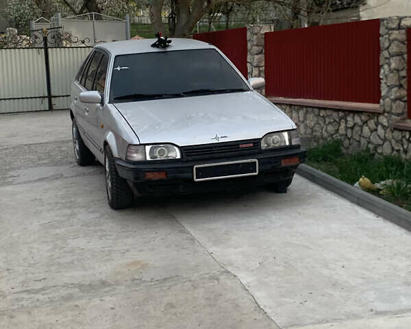 Серый Мазда 323, объемом двигателя 1.32 л и пробегом 460 тыс. км за 1500 $, фото 1 на Automoto.ua