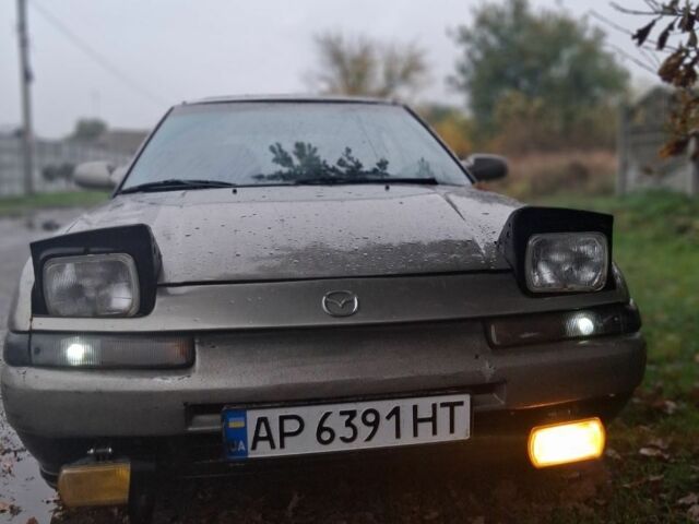 Сірий Мазда 323, об'ємом двигуна 1.6 л та пробігом 150 тис. км за 1496 $, фото 1 на Automoto.ua