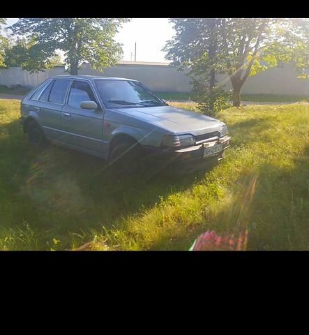 Серый Мазда 323, объемом двигателя 1.3 л и пробегом 222 тыс. км за 200 $, фото 1 на Automoto.ua