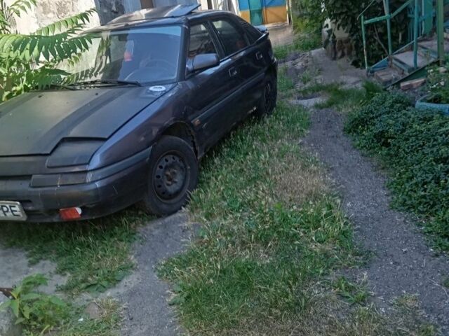 Серый Мазда 323, объемом двигателя 0 л и пробегом 320 тыс. км за 798 $, фото 1 на Automoto.ua