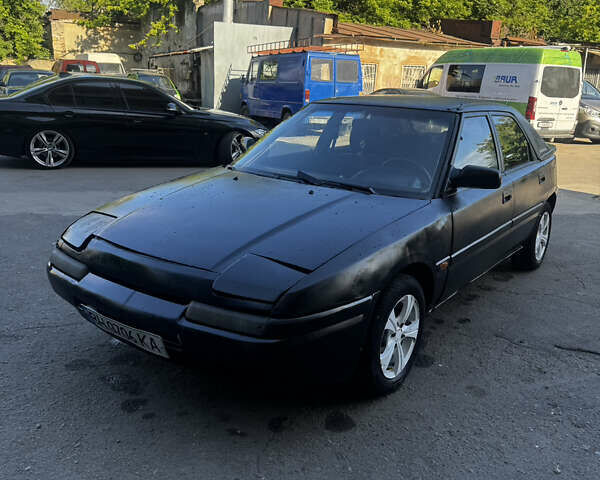 Сірий Мазда 323, об'ємом двигуна 1.6 л та пробігом 185 тис. км за 950 $, фото 1 на Automoto.ua