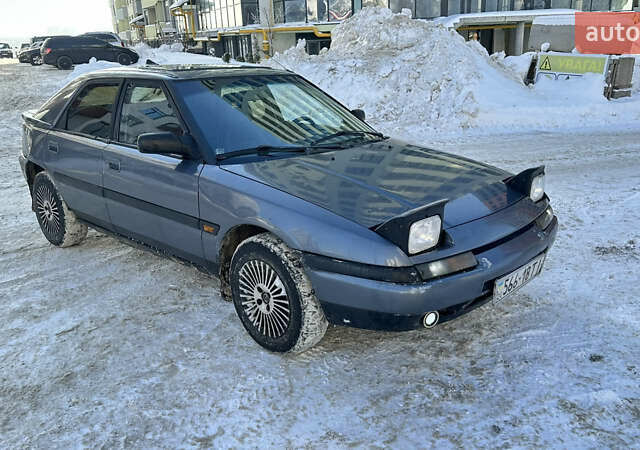 Серый Мазда 323, объемом двигателя 1.84 л и пробегом 250 тыс. км за 900 $, фото 1 на Automoto.ua