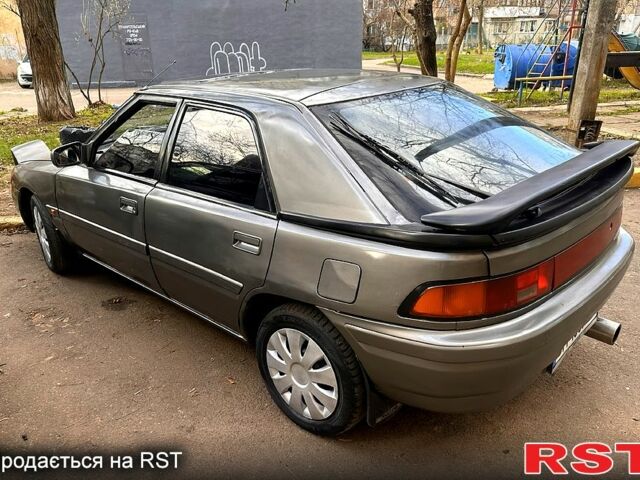 Серый Мазда 323, объемом двигателя 1.6 л и пробегом 200 тыс. км за 1200 $, фото 1 на Automoto.ua