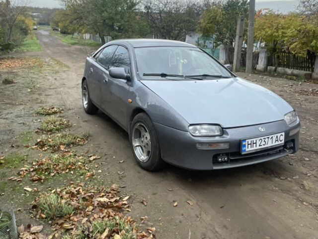 Серый Мазда 323, объемом двигателя 2 л и пробегом 280 тыс. км за 2000 $, фото 1 на Automoto.ua
