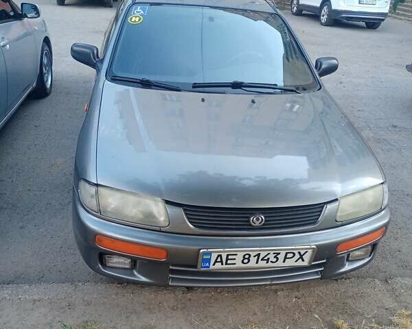 Сірий Мазда 323, об'ємом двигуна 1.49 л та пробігом 300 тис. км за 2600 $, фото 1 на Automoto.ua